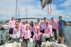 Corporate sailing day team photo on yacht